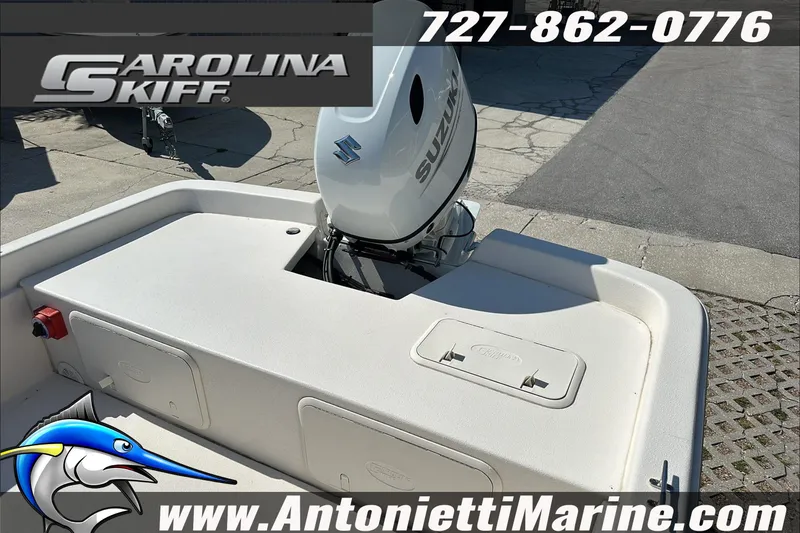 Slide: The Image of 2024 Carolina Skiff E21 DLX CC boat with Suzuki engine, displayed at Antonietti Marine. - 12