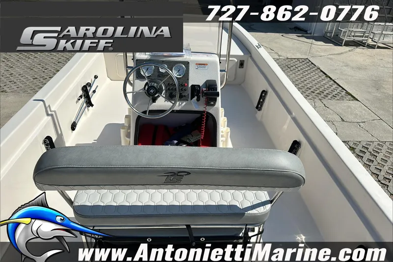 Slide: The Image of 2024 Carolina Skiff E21 DLX CC boat interior with steering console and seating. - 15
