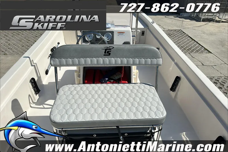 Slide: The Image of 2024 Carolina Skiff E21 DLX CC boat interior with seating and console, Antonietti Marine branding. - 16