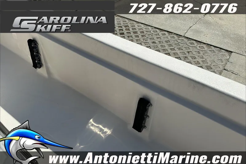 Slide: The Image of 2024 Carolina Skiff E21 DLX CC boat interior with contact details and logo. - 17