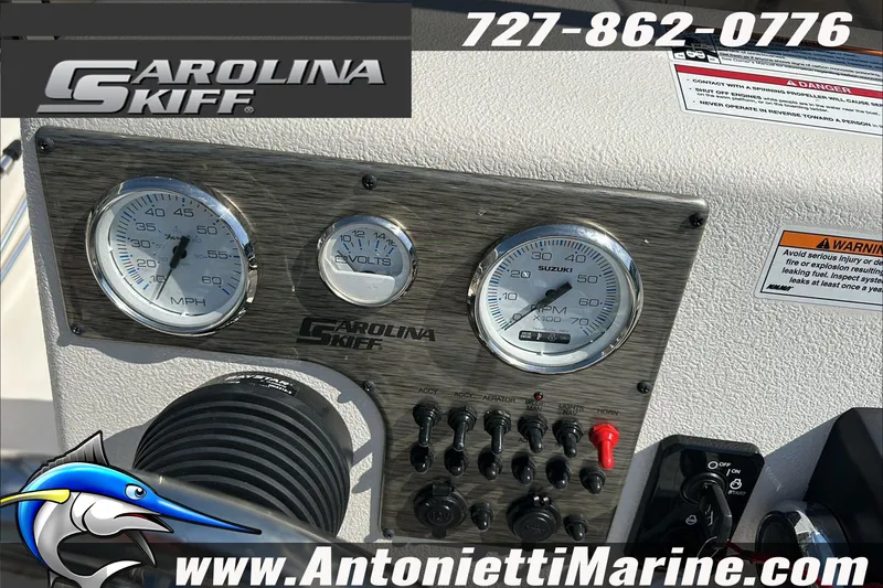 Slide: The Image of Dashboard of 2024 Carolina Skiff E21 DLX CC with gauges and controls. - 19