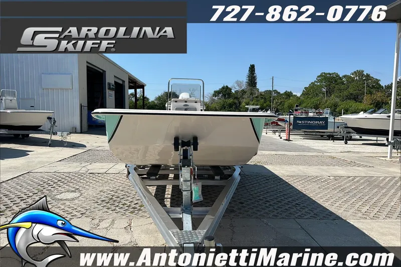 Slide: The Image of 2024 Carolina Skiff E21 DLX CC boat on trailer at Antonietti Marine dealership. - 3