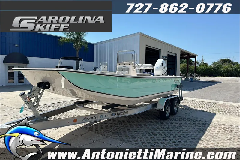Slide: The Image of 2024 Carolina Skiff E21 DLX CC boat on trailer at Antonietti Marine dealership. - 4