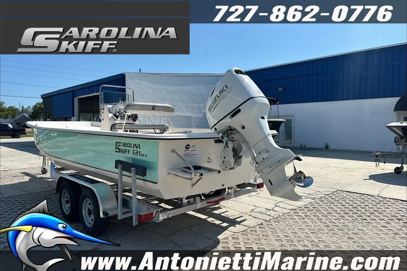 Slide: The Image of 2024 Carolina Skiff E21 DLX CC boat on trailer, displayed at Antonietti Marine. - 6