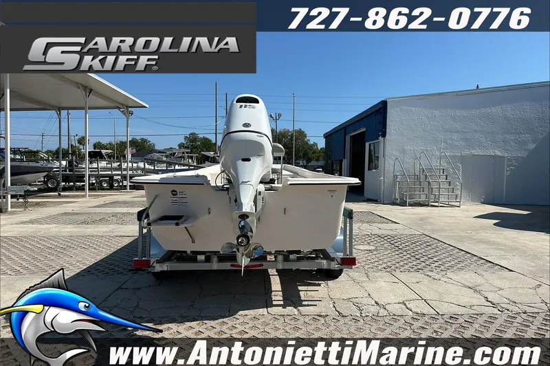 Slide: The Image of 2024 Carolina Skiff E21 DLX CC boat displayed at Antonietti Marine dealership. - 7
