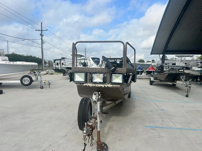 Slide: The Image of 2013 Pro-Drive 20 SBX boat on a trailer in a parking lot. - 3