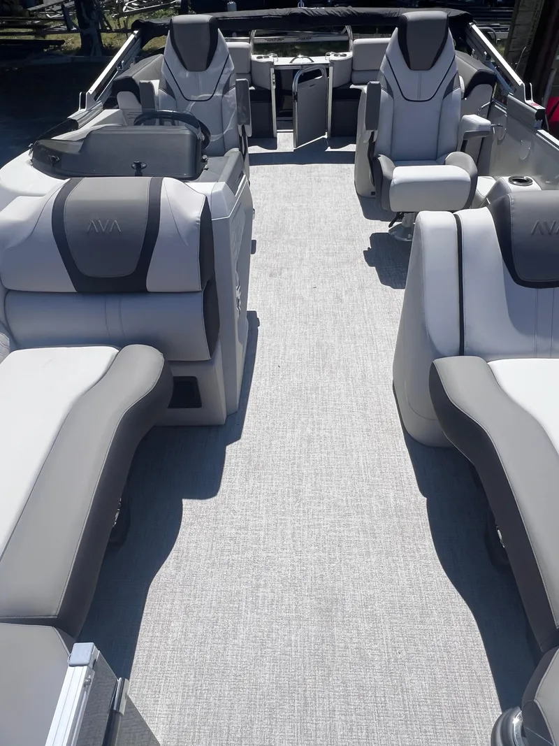 Slide: The Image of 2024 Avalon Catalina Quad Lounge 23' interior with spacious seating and modern design. - 10