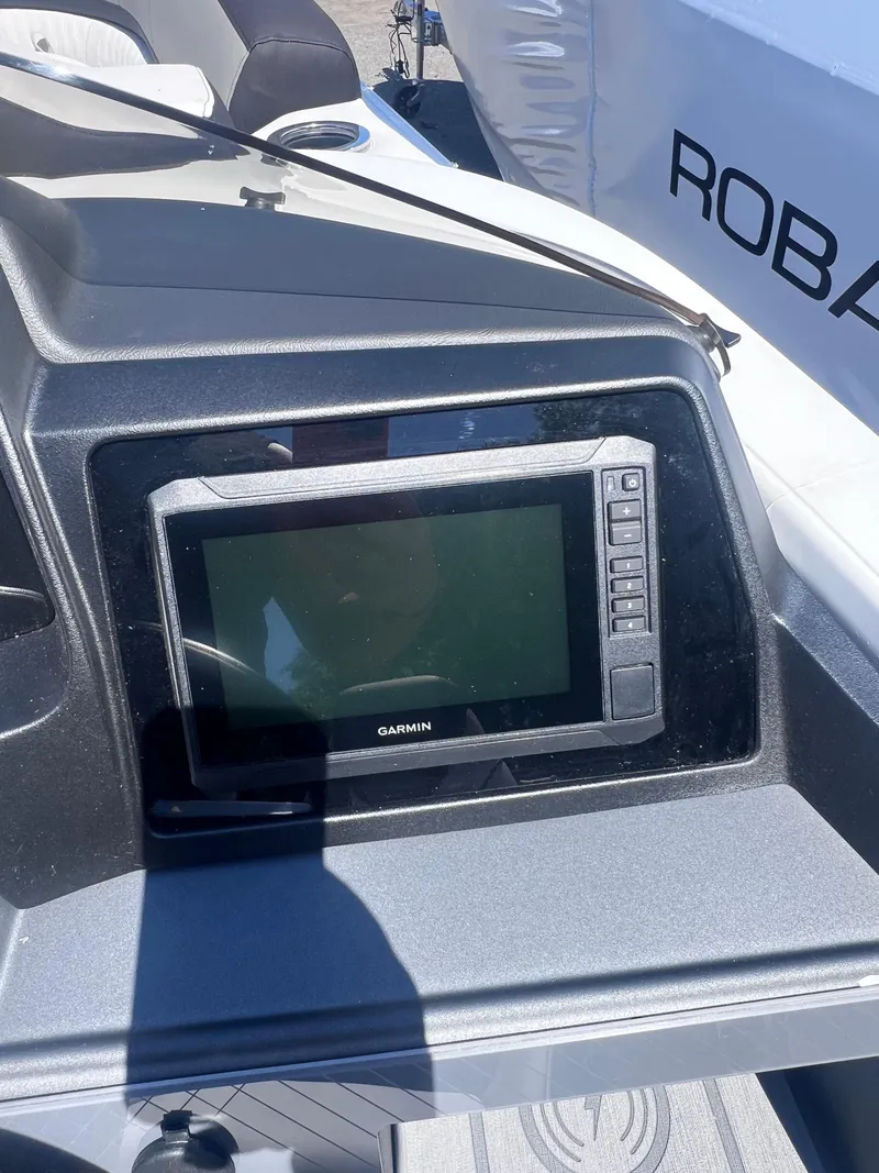 Slide: The Image of 2024 Avalon Catalina Quad Lounge 23' interior with plush seating and modern design. - 14