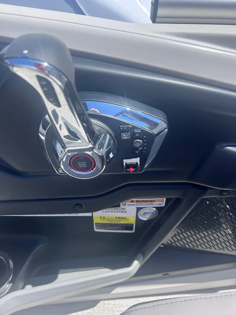 Slide: The Image of 2024 Avalon Catalina Quad Lounge 23' boat cockpit with Garmin navigation system. - 7