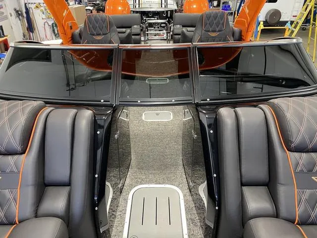 Slide: The Image of 2024 Bennington 27 QXFBWA T2 boat interior with luxury seating and modern design. - 10