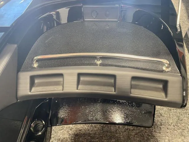 Slide: The Image of 2024 Bennington 27 QXFBWA T2 boat interior with storage compartments and railing. - 17