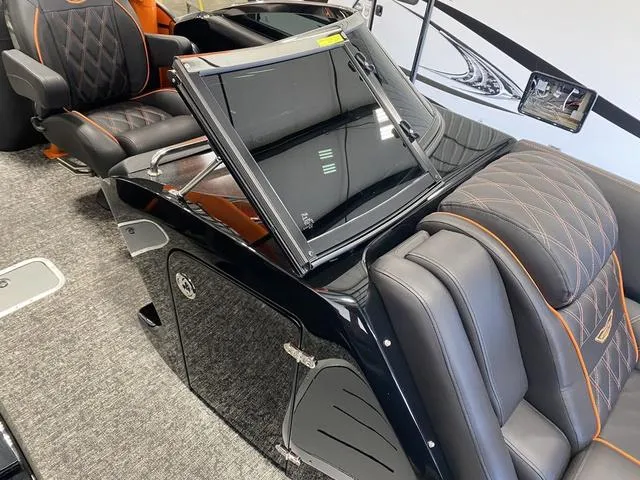 Slide: The Image of 2024 Bennington 27 QXFBWA T2 interior with luxurious seating and modern design. - 18