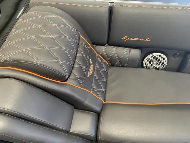 Slide: The Image of 2024 Bennington 27 QXFBWA T2 boat interior with luxurious leather seating and orange stitching. - 20