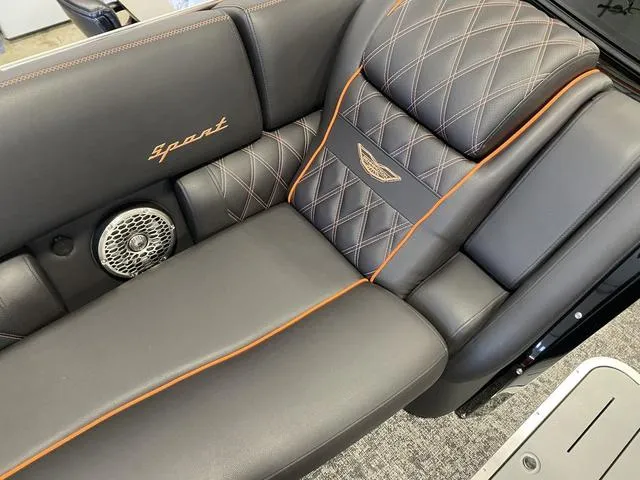 Slide: The Image of 2024 Bennington 27 QXFBWA T2 boat interior with luxurious leather seating and orange stitching. - 21
