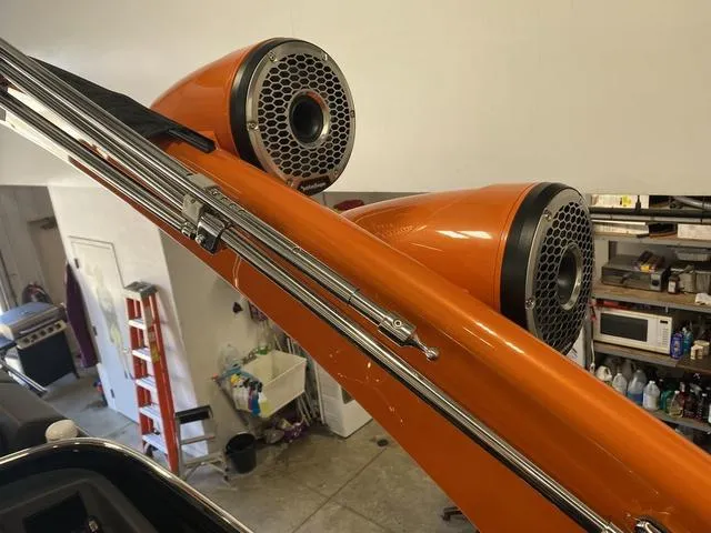 Slide: The Image of Close-up of 2024 Bennington 27 QXFBWA T2 boat's orange speakers. - 25