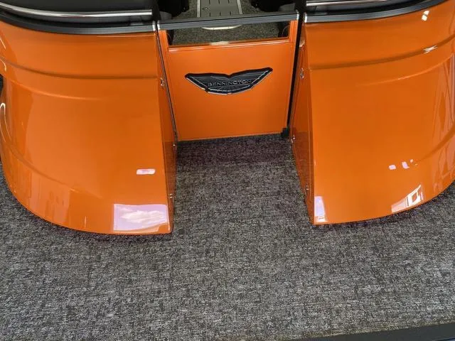 Slide: The Image of 2024 Bennington 27 QXFBWA T2 boat rear view with orange exterior. - 28