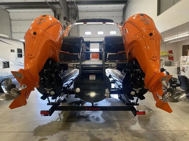 Slide: The Image of 2024 Bennington 27 QXFBWA T2 boat with dual orange Yamaha outboard motors. - 7