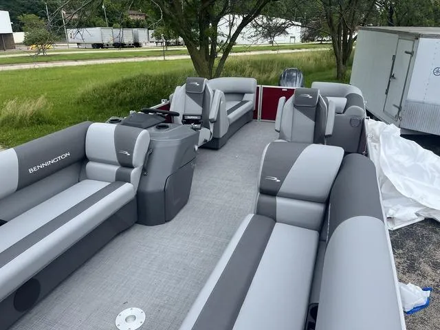 Slide: The Image of 2024 Bennington 22 SVSR pontoon boat with spacious seating and modern design. - 6