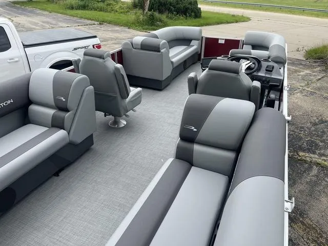 Slide: The Image of 2024 Bennington 22 SVSR boat helm with steering wheel and control panel. - 9