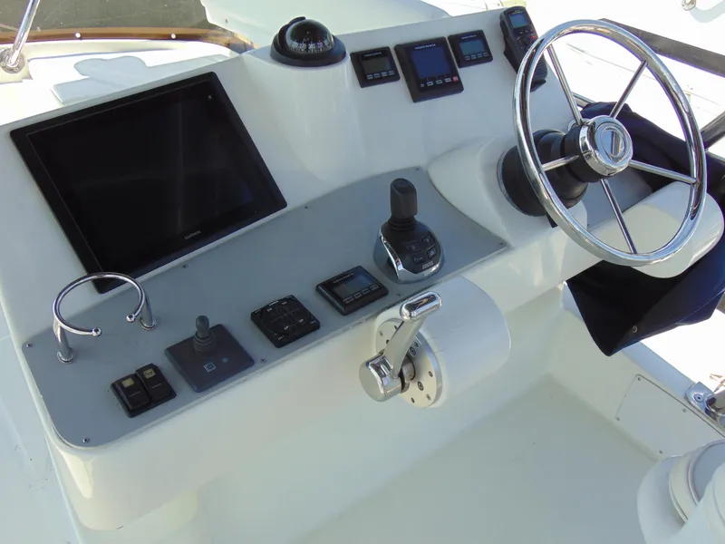 Slide: The Image of Control panel of a 2014 Rodman 1250 ADV Fisher Cruiser boat. - 20