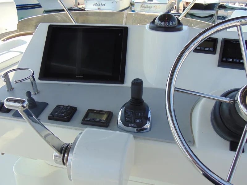 Slide: The Image of Rodman 1250 ADV Fisher Cruiser 2014 helm station with navigation equipment and controls. - 23