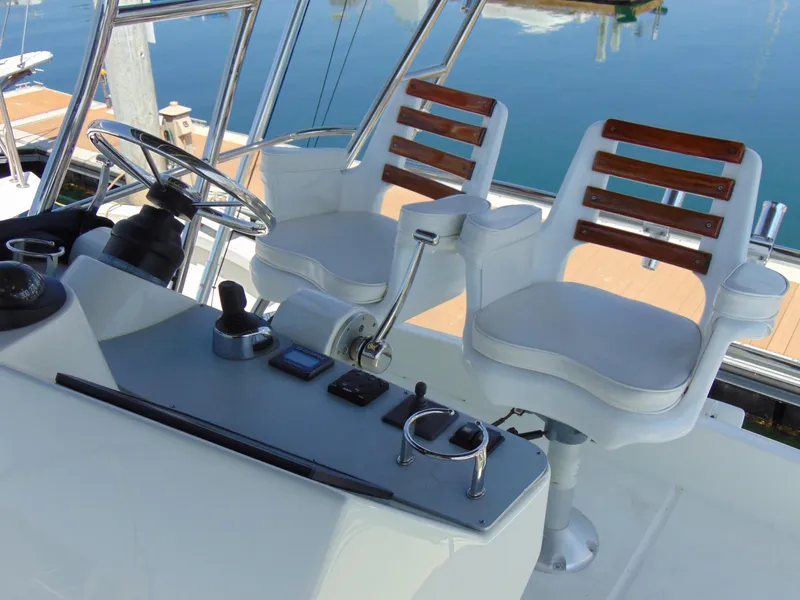 Slide: The Image of Cockpit of 2014 Rodman 1250 ADV Fisher Cruiser with dual captain chairs. - 24