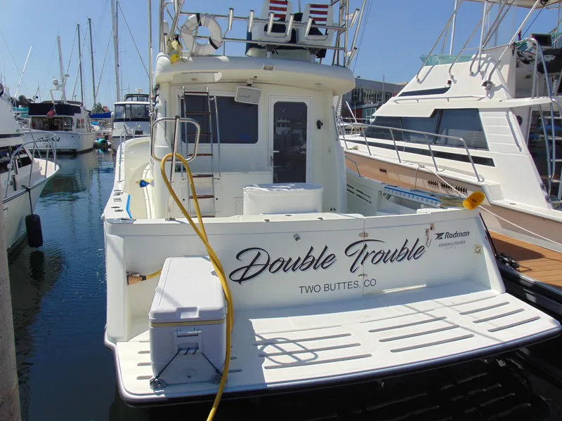 Slide: The Image of Rodman 1250 ADV Fisher Cruiser 2014 docked, named Double Trouble, in a marina. - 29