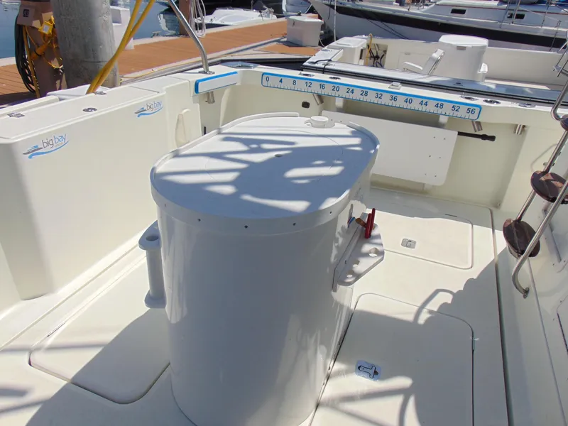 Slide: The Image of Rodman 1250 ADV Fisher Cruiser 2014 boat deck with fishing equipment and storage. - 30