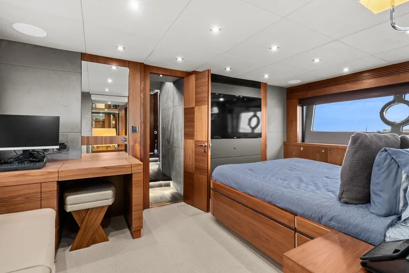 Slide: The Image of Luxurious master bedroom on a 2014 Sunseeker 75 Yacht with modern furnishings. - 29