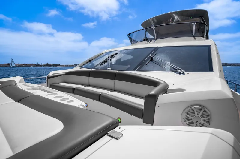 Slide: The Image of 2014 Sunseeker 75 Yacht with luxurious seating on deck, cruising on a sunny day. - 46