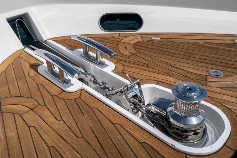 Slide: The Image of Anchor winch and cleats on teak deck of 2014 Sunseeker 75 Yacht. - 48