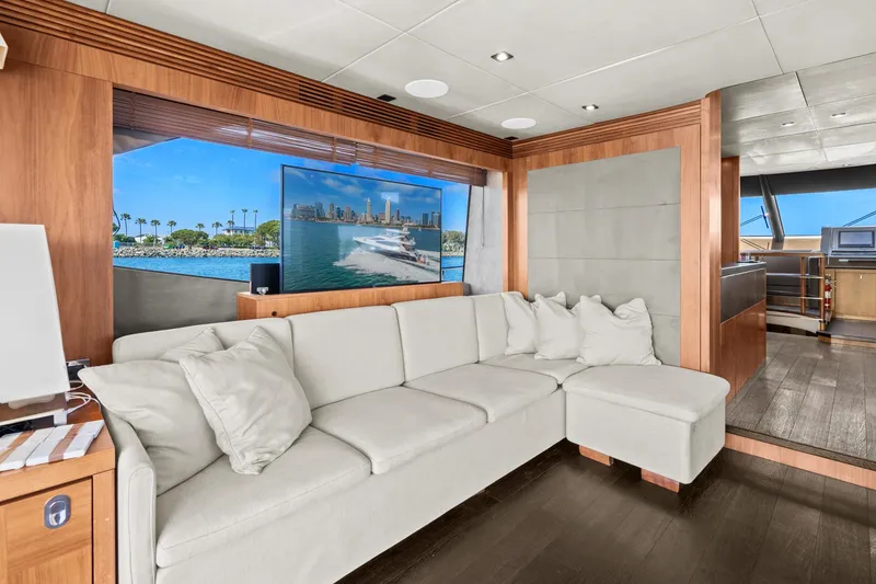 Slide: The Image of Luxurious interior of a 2014 Sunseeker 75 Yacht with a white sectional sofa. - 5