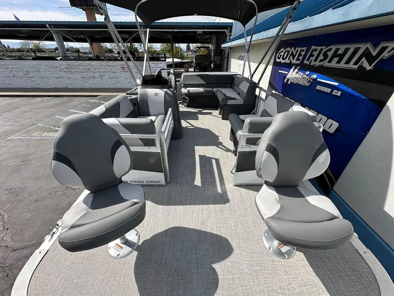 Slide: The Image of 2024 Tahoe Pontoon Sport Cruise Bow Fish interior with seating and fishing chairs. - 13