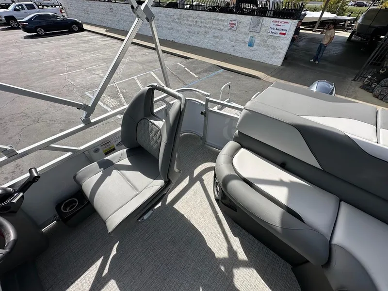 Slide: The Image of 2024 Tahoe Pontoon Sport Cruise Bow Fish interior with seating and cup holders. - 17