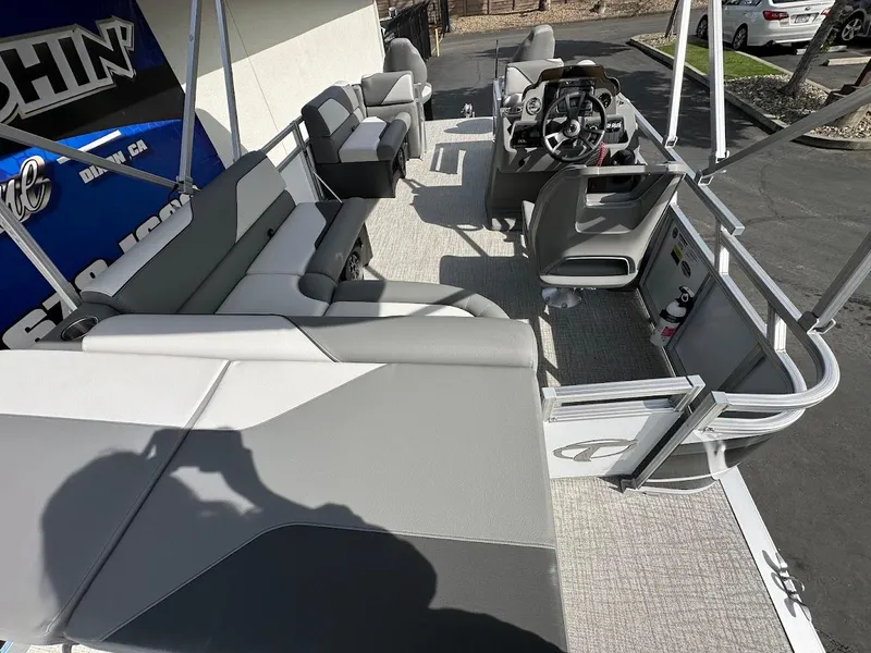Slide: The Image of 2024 Tahoe Pontoon Sport Cruise Bow Fish interior with seating and steering console. - 26
