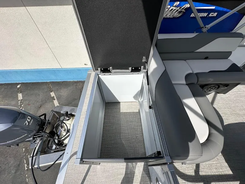 Slide: The Image of 2024 Tahoe Pontoon Sport Cruise Bow Fish storage compartment and seating area. - 30