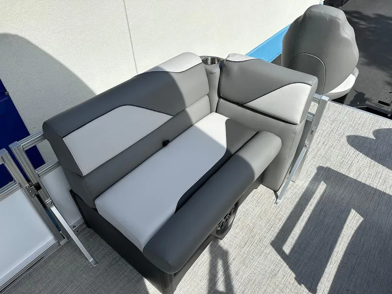 Slide: The Image of 2024 Tahoe Pontoon Sport Cruise Bow Fish seating area with gray and white upholstery. - 34