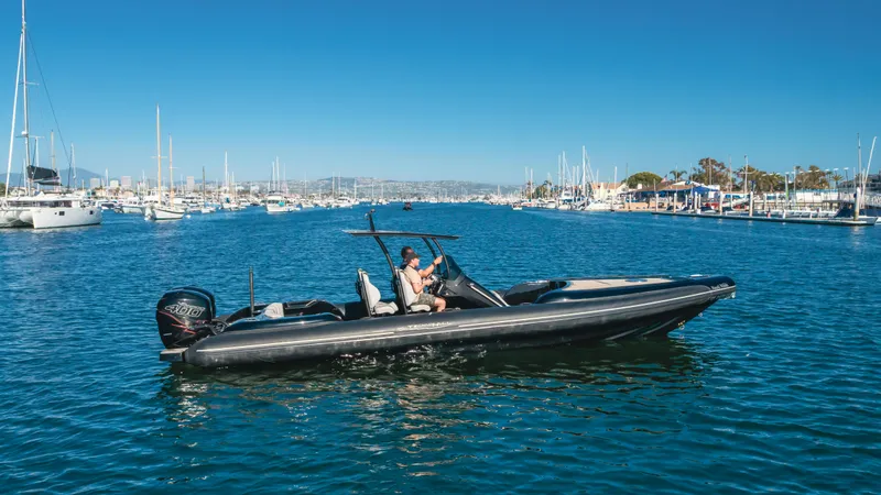 Slide: The Image of 2019 Technohull 34 Sea DNA 999 boat cruising in a marina. - 1
