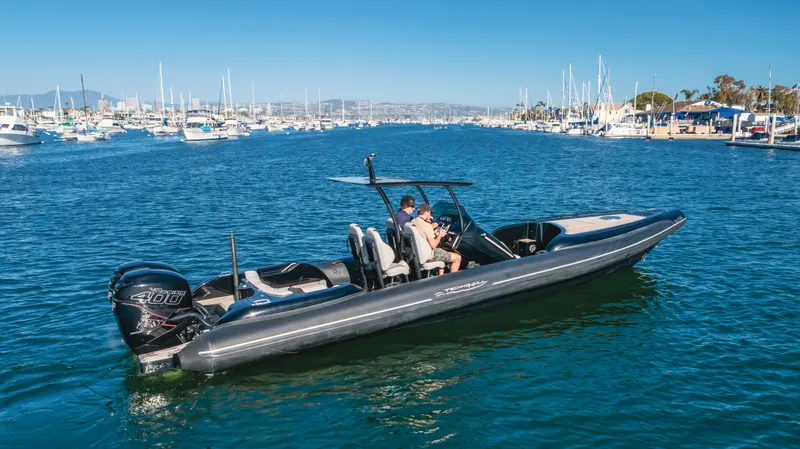 Slide: The Image of 2019 Technohull 34 Sea DNA 999 boat cruising in a marina. - 11