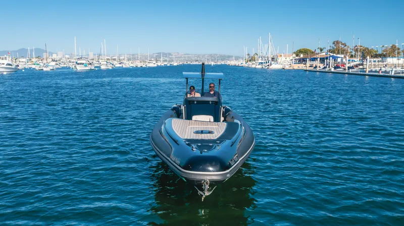 Slide: The Image of 2019 Technohull 34 Sea DNA 999 boat cruising in a marina. - 12