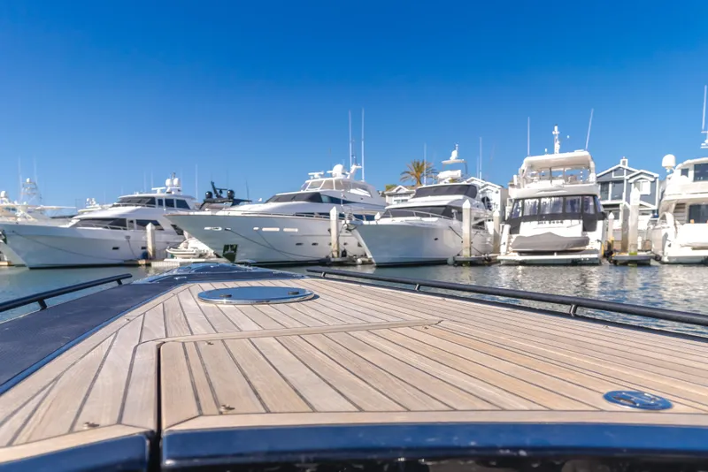 Slide: The Image of 2019 Technohull 34 Sea DNA 999 yacht docked in a marina with other luxury boats. - 16
