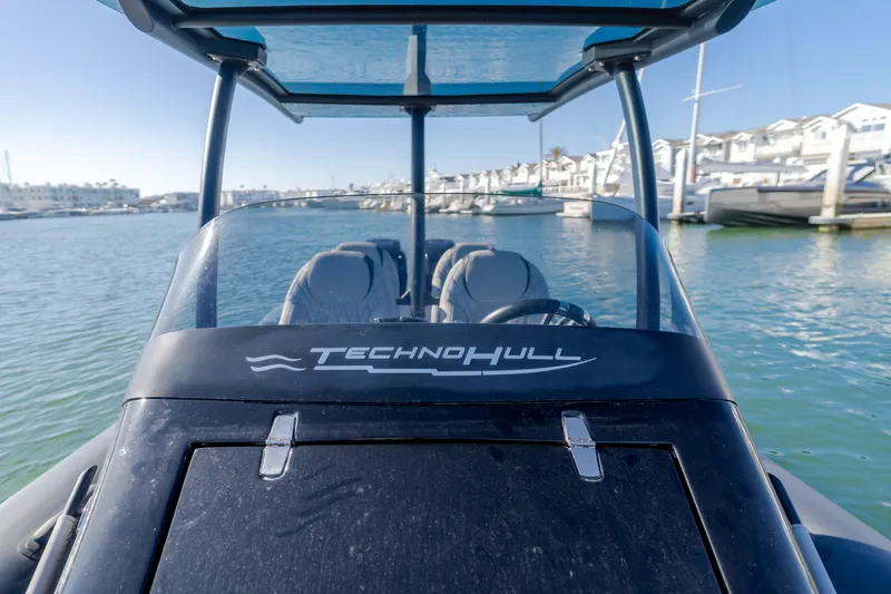 Slide: The Image of 2019 Technohull 34 Sea DNA 999 boat docked at marina. - 22