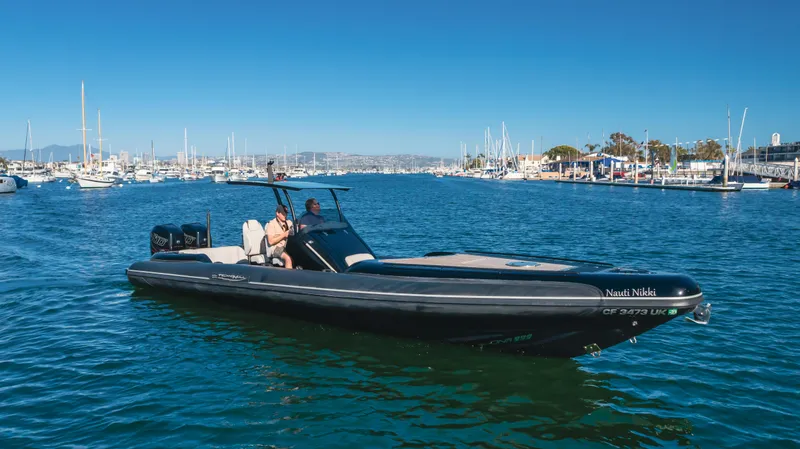 Slide: The Image of 2019 Technohull 34 Sea DNA 999 boat cruising in a marina. - 4