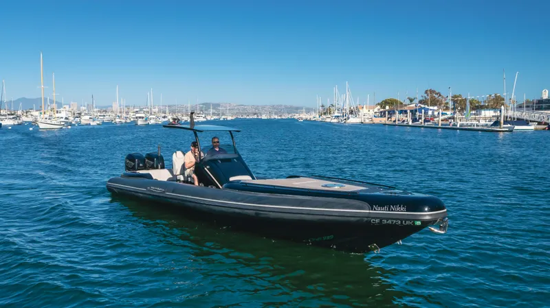 Slide: The Image of 2019 Technohull 34 Sea DNA 999 boat cruising in a marina. - 5