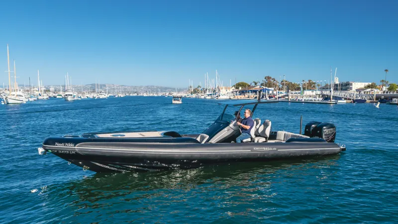 Slide: The Image of 2019 Technohull 34 Sea DNA 999 boat cruising in a marina. - 6