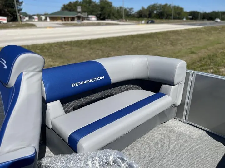 Slide: The Image of 2024 Bennington S 20 SSR boat with blue and gray seating. - 15