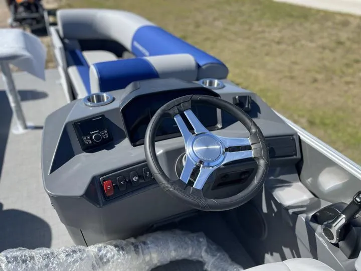 Slide: The Image of 2024 Bennington S 20 SSR boat interior with steering wheel and control panel. - 20