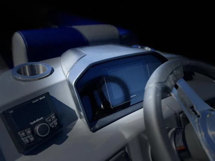 Slide: The Image of 2024 Bennington S 20 SSR boat dashboard with steering wheel and control panel. - 23