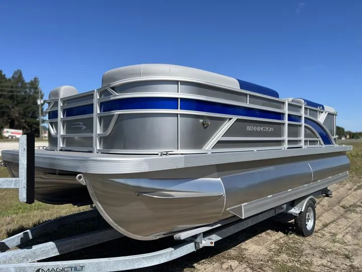 Slide: The Image of 2024 Bennington S 20 SSR pontoon boat on a trailer. - 3