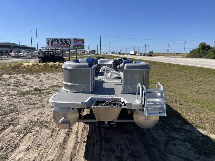Slide: The Image of 2024 Bennington S 20 SSR pontoon boat on display outdoors. - 6